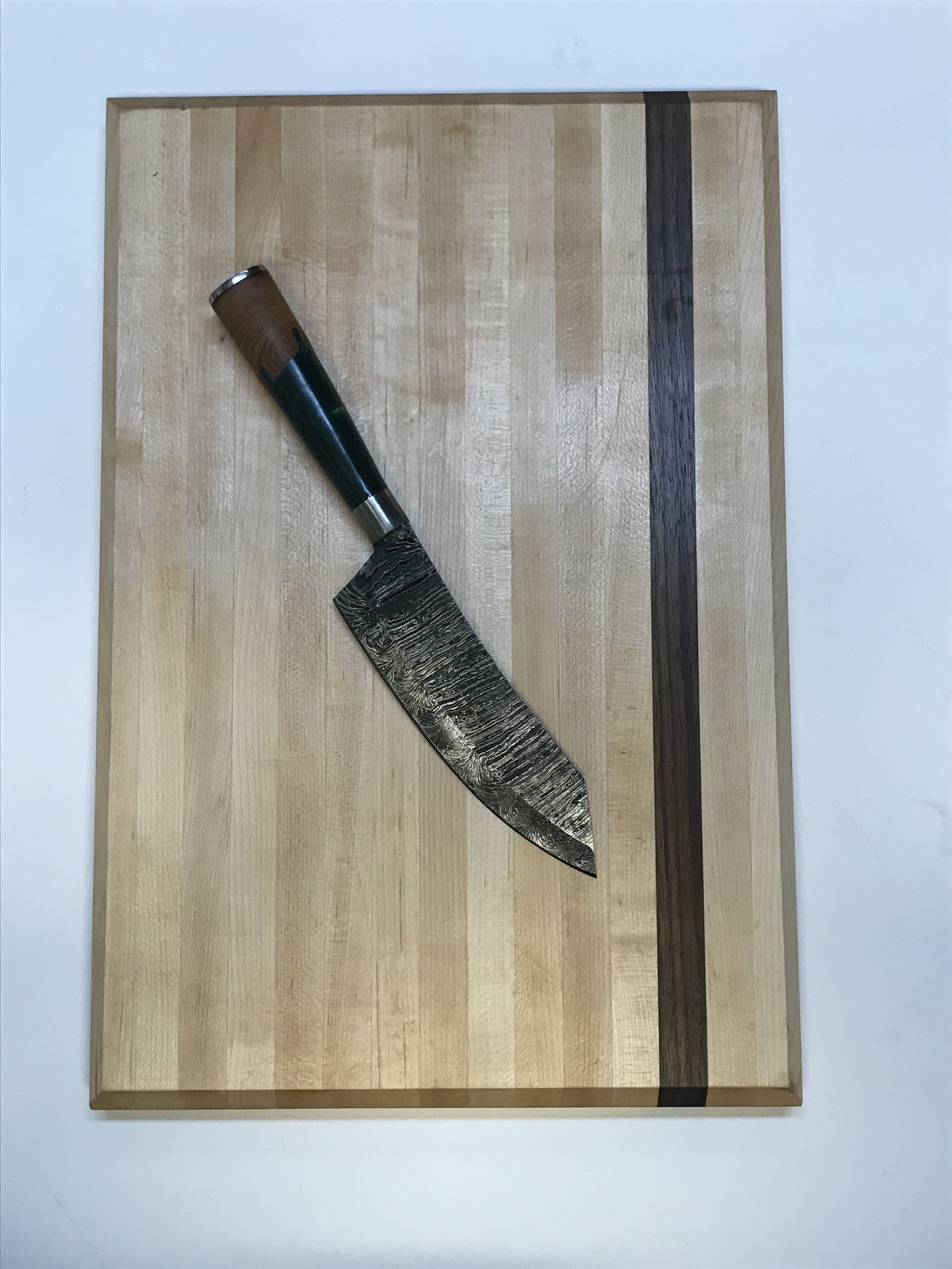Maple cutting board with walnut stripe