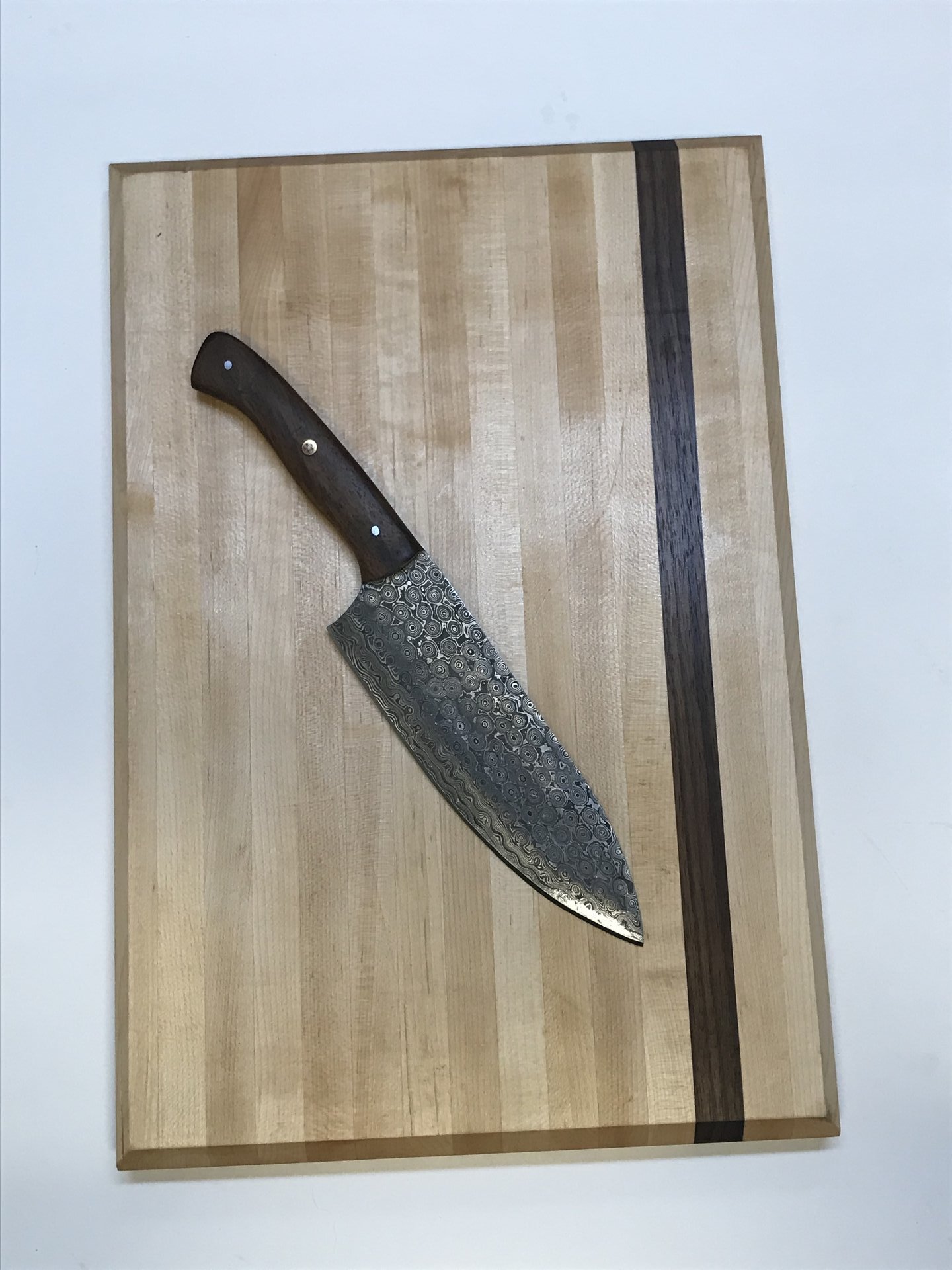 Maple cutting board with walnut stripe