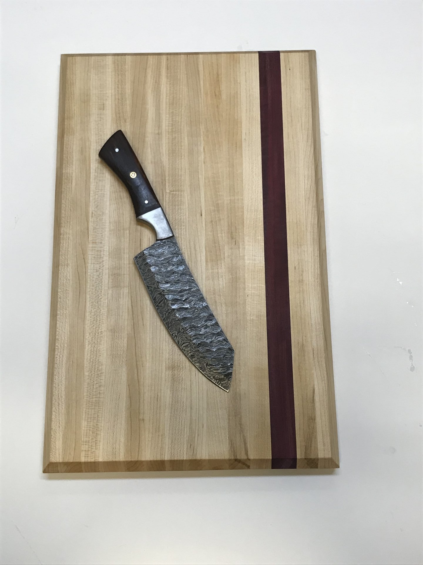 Maple cutting board with purpleheart stripe